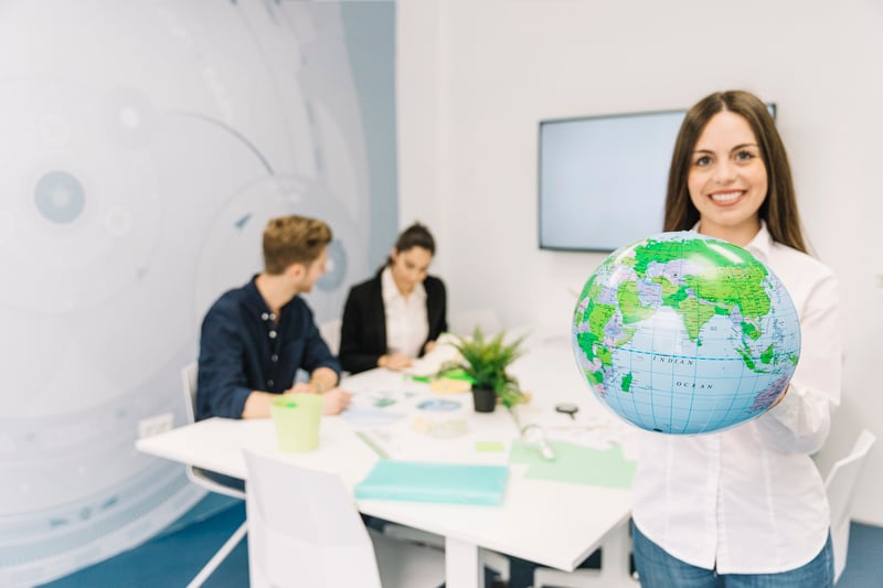 globeportrait-of-a-happy-businesswoman-holding-globe